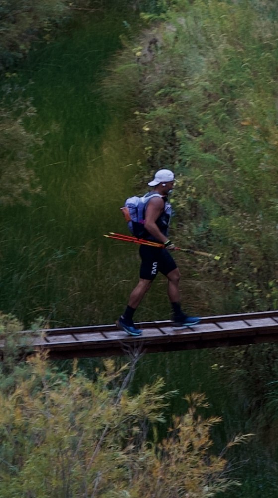 Crossing a footbridge on the trail